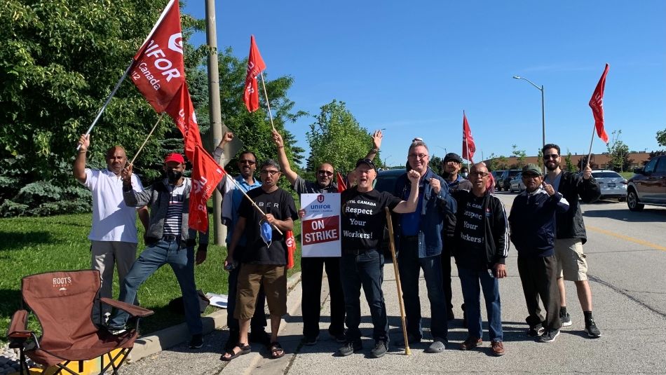 Unifor Local 112 members stand on the picket line at UTIL in Concord, Ontario. 