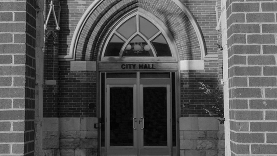 Outside view of the front doors of Belleville's town hall in black and white