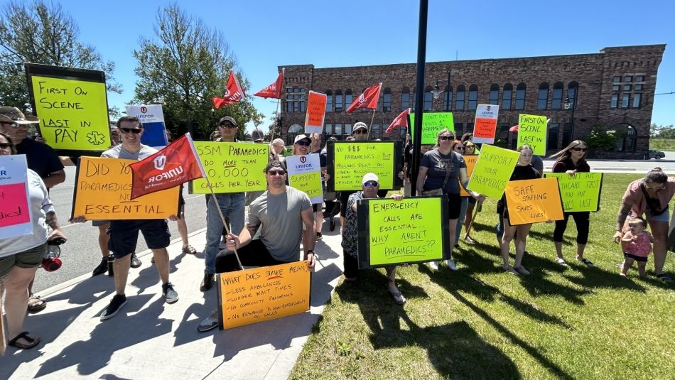 A large group holding place cards