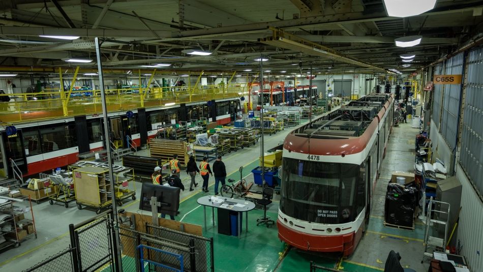 TTC car and workers inside the Alstom plant in Thunder Bay
