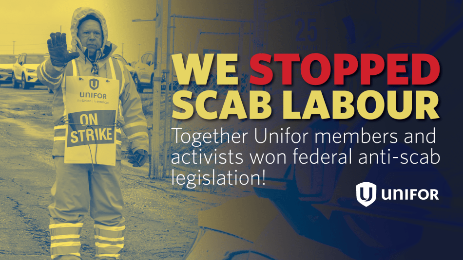 We stopped scab labour, a person with their hand held up wearing an "on strike" place card