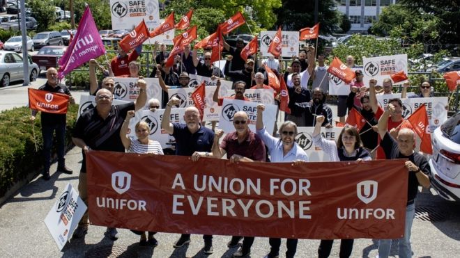 People holding a union for everyone banner