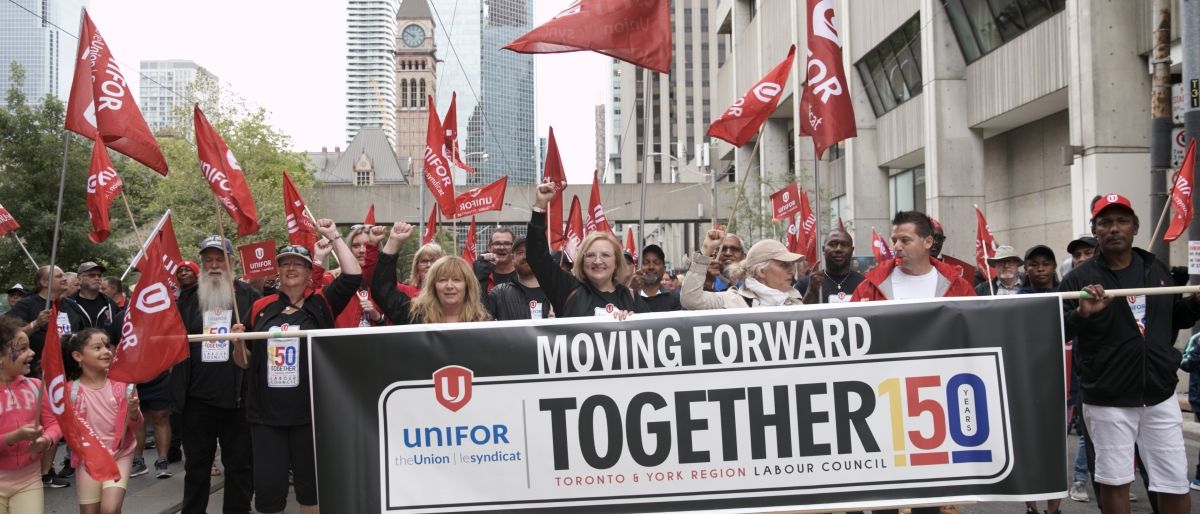 Unifor Mational President Lana Payne marching in the Toronto Labour Day parade with hundreds of Unifor members